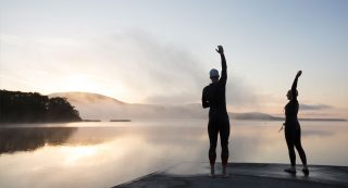 Pre swim early morning stretch at Ballycuggaran, near Killaloe County Clare