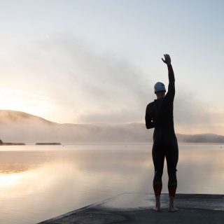 Pre swim early morning stretch at Ballycuggaran, near Killaloe County Clare