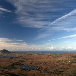 The view of Ballinakill Bay and the Connemara coast, including Tully Mountain, seen from Diamond Hill, a mountain in the Twelve Bens (or Pins) range, part of Connemara National Park, Galway, Ireland