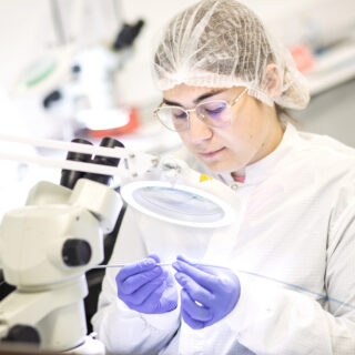 Girl working in a clean room in Vistamed Medical Devices, Carrick on Shannon, County Leitrim